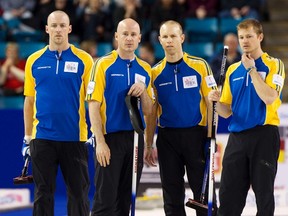 Team Alberta Nolan Thiessen, Kevin Koe, Pat Simmons and Carter Rycroft talk while facing team Quebec during the semi-final draw at the 2014 Tim Hortons Brier curling championships in Kamloops, British Columbia March 8, 2014.   (REUTERS/Ben Nelms)