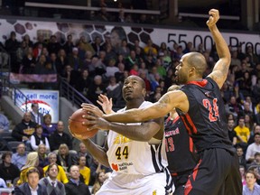 London Lightning player Jermaine Johnson looks to the net as he is pressured by Brampton A's player Cavell Johnson during their NBL Canada basketball game at Budweiser Gardens in London, Ontario on Wednesday March 5, 2014. (Free Press file photo)