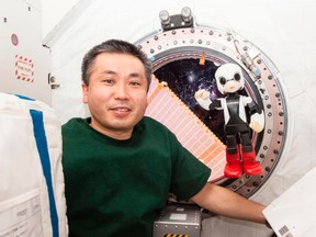 Humanoid communication robot Kirobo, right, and Japanese astronaut Koichi Wakata exchange messages in their first communication session between a robot and a human being in space, at the International Space Station (ISS) December 6, 2013 in this picture released by Kibo Robot Project on December 19, 2013. (REUTERS/Kibo Robot Project/Handout via Reuters)