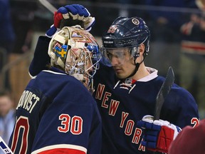 New York Rangers goalie Henrik Lundqvist (30) and New York Rangers left wing Chris Kreider (20) celebrate after defeating the Detroit Red Wings at Madison Square Garden. (Adam Hunger-USA TODAY Sports)