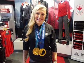Two-time Olympic gold medalist Kaillie Humphries paid shoppers at SportChek in West Edmonton Mall a visit on Sunday afternoon, taking time to sign autographs and take pictures with fans. Photo by Trevor Robb