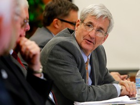 Quinte Health Care director David MacKinnon listens during a discussion at the corporation's Jan. 28 board meeting in Belleville. He's suing The Wellington Times Inc., its president and two letter-writers for libel.