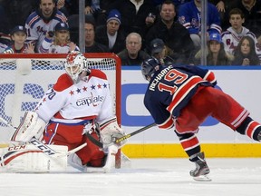 New York Rangers centre Brad Richards (19) shoots wide past Washington Capitals goalie Braden Holtby in the shootout after the overtime period of their NHL hockey game at Madison Square Garden in New York March 24, 2013. (REUTERS)