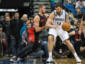 Jonas Valanciunas defends against Nikola Pekovic of the Timberwolves during Sunday night's game at Minneapolis. Kyle Lowry had a triple-double as the Raps won 111-104. (USA TODAY SPORTS)