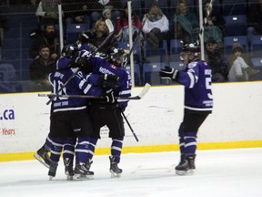 London Nationals players celebrate a goal by forward Austin Kemp during the 2nd period of their 4-1 win over the Sarnia Legionnaires on Sunday night. The win gave London a 4-3 series victory in the first round of playoffs and advances them to the 2nd round where they will meet Leamington. SHAUN BISSON/THE OBSERVER/QMI AGENCY