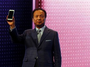 JK Shin, president and Head of IT and Mobile Communication Division of Samsung Electronics, presents the company's new Galaxy S5 smartphone during its launching ceremony at the Mobile World Congress in Barcelona Feb. 24, 2014. REUTERS/Gustau Nacarino