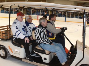 Red Kelly, Larry Jeffrey and Joe O’Brien are escorted around the Maitland Recreation Centre ice during the opening ceremony of Young Canada Week.