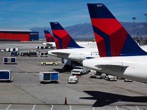 Delta planes line up at their gates while on the tarmac of Salt Lake City International Airport in Utah in this file photo taken September 28, 2013. (REUTERS/Lucas Jackson/Files)