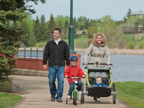 A family goes out for a stroll on one of Camrose's many walking trails.