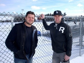 Kingston natives Mike Giffin, left, now retired from the CFL, and Rob Bagg of the Grey Cup champion Saskatchewan Roughriders are hosting a football skills and coaching camp at CaraCo Field April 25-27. (Ian MacAlpine/The Whig-Standard)