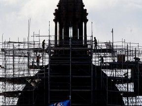 Crews work to remove scaffolding from the dome of the Alberta Legislature, in Edmonton Alta., on Monday March 10, 2014. David Bloom/Edmonton Sun/QMI Agency