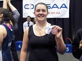 Central Elgin Collegiate Institute wrestler Mackenzie Gosse holds her OFSAA bronze medal. Submitted photo