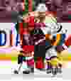 Ottawa Senators' Kyle Turris gets tangles up with Nashville Predators' Paul Gaustad during NHL hockey action at the Canadian Tire Centre in Ottawa, Ontario on Monday March 10, 2014. Errol McGihon/Ottawa Sun/QMI Agency