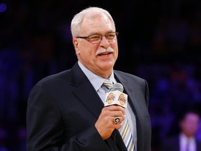 Former Los Angeles Lakers head coach Phil Jackson speaks during a ceremony to retire jersey #34 in honor of former Los Angeles Lakers player Shaquille O'Neal during halftime of their NBA basketball game against the Dallas Mavericks in Los Angeles April 2, 2013. (REUTERS/Danny Moloshok)