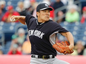 New York Yankees starting pitcher Masahiro Tanaka (19) throws a pitch during the first inning against the Philadelphia Phillies at Bright House Field on Mar 6, 2014 in Clearwater, FL, USA. (Kim Klement/USA TODAY Sports)