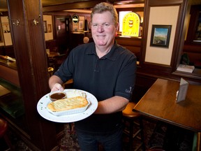 Mike McCoubrey presents steak and Guinness pie at the Waltzing Weasel. It will be among the Irish favourites on tap Monday along with Irish stew. (DEREK RUTTAN, The London Free Press)