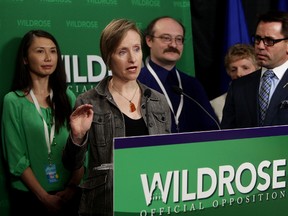 Maurya Braun (2nd from left), a parent of a Grade 7 Edmonton student, calls for a halt to provincial math curriculum changes, during a press conference at the Legislature Annex in Edmonton Alta., on Tuesday March 11, 2014. David Bloom/Edmonton Sun/QMI Agency