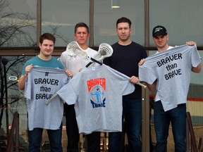 Edmonton Rush players, from left, Robert Church, John Lintz, Mark Mathews and Riley Loewen, pose with Braver than Brave T-shirts. (Perry Mah, Edmonton Sun)