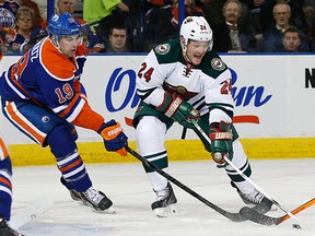 Matt Cooke battles Justin Schultz for the puck during a game at Rexall Place in February. (USA TODAY)