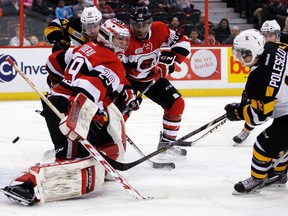 Ottawa 67's goalie Philippe Trudeau stops Kingston Frontenacs forward Robert Polesello in the first period of OHL action at the Canadian Tire Centre in Ottawa on Tuesday night. The Frontenacs won 4-2. (Darren Brown/QMI Agency)