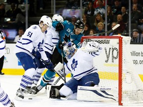 San Jose Sharks left wing James Sheppard tries to score on Toronto Maple Leafs goalie James Reimer as blueliner Jake Gardiner defends at the SAP Center in San Jose, March 11, 2014. (BOB STANTON/USA Today)