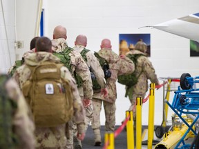 Twenty-two Canadian Forces soldiers and sailors arrived from Afghanistan at Shell Aerocentre in Leduc, Alta., on January 23, 2014. (Ian Kucerak/QMI Agency)