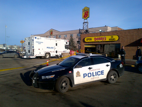 Edmonton police homicide detectives probe a suspicious death in west Edmonton, at a truck stop at 168 Street and 118 Avenue. (PERRY MAH/EDMONTON SUN)