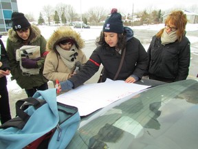 In this file photo, Vanessa Gray maps out the route for other organizers before the start of a Toxic Tour of Chemical Valley held in December at Aamjiwnaang First Nation. The National Energy Board recently approved Enbridge's Line 9 reversal project that is opposed by several environmental and First Nation Groups. (Observer file photo)