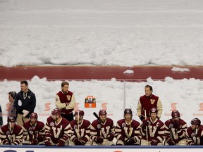 Head coach John Tortorella stands behind the Canucks bench during first period action of the NHL's Heritage Classic game against the Senators at B.C. Place Stadium in Vancouver on Sunday, March 2, 2014. (Carmine Marinelli/QMI Agency)