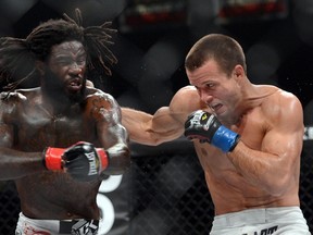 Daniel Straus (red gloves) and Pat Curran (blue gloves) during their Bellator featherweight world championship fight in 2013. (Jayne Kamin-Oncea-USA TODAY Sports)