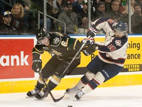 Saginaw Spirit forward Terry Trafford, right, was found dead in his truck on Tuesday, March 11 after having been missing since March 3. Trafford, who is remembered by many in the hockey community for his ear to ear smile and prankster personality, is pictured here in a game against the London Knights on Sunday February 24, 2013. CRAIG GLOVER/ The London Free Press / QMI AGENCY