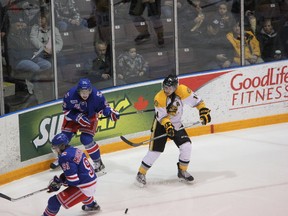 Sarnia Sting captain Nick Latta (right) will play his last home game as a member of the organization on Thursday night when they host the Kitchener Rangers. He is pictured above playing against those same Rangers on Thursday, Nov. 14, 2013. SHAUN BISSON/ THE OBSERVER/ QMI AGENCY