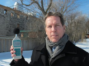 Phillip Brown has been using a handheld detector to take readings of noise levels around his home. (Paul Schliesmann The Whig-Standard)