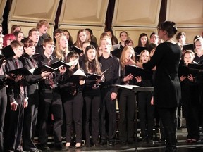 Conductor and music teacher Kristen Darsaut leads the Banting choir during the school music festival. The night showcased the school talent before the upcoming Kiwanis festival.
