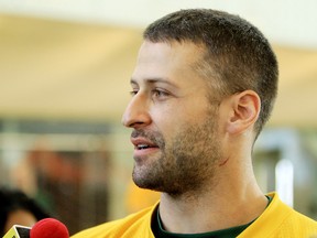 Mike Reilly, shown here at practice last season, says he has beeefed up to about 230 pounds to be ready for the wear and tear of the season. (David Bloom, Edmonton Sun)