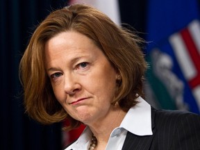 Alberta premier Alison Redford announces that she will pay back the entire $45,000 travel costs for her controversial South Africa trip during a statement at the Alberta Legislature Building in Edmonton, Alta., on Wednesday, March 12, 2014. Codie McLachlan/Edmonton Sun