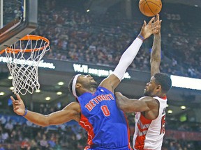 Raptors’ Amir Johnson shoots over Pistons’ Andre Drummond during Wednesday night’s game at the ACC. (CRAIG ROBERTSON/Toronto Sun)