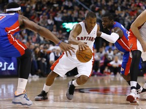 Raptors' Kyle Lowry weaves his way through the Detroit Pistons on March 12. (Craig Robertson/Toronto Sun/QMI Agency)
