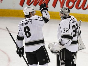 Los Angeles Kings defenceman Drew Doughty (8) and goaltender Jonathan Quick (32) celebrate their team's win over the Edmonton Oilers at Rexall Place in Edmonton, Alta., on Sunday, March 9, 2014. The Kings won 4-2. (IAN KUCERAK/QMI Agency)