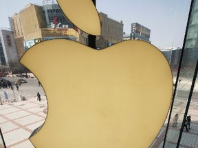 Apple Inc's logo is seen at its Apple store in Beijing April 2, 2013. REUTERS/Kim Kyung-Hoon