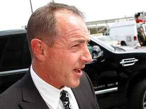 Michael Lohan, father of actress Lindsay Lohan, departs from court after a plea deal at the Airport Branch of the Los Angeles Superior Courthouse in Los Angeles, California March 18, 2013. (REUTERS/Patrick T. Fallon)