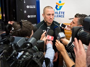 Georges St. Pierre addresses the media on Jan. 14, 2014. (QMI Agency)