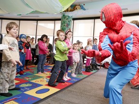 These kids had a super day Thursday taking part in one of the Belleville Public Library's March Break day camps. Here, special visitor Spiderman shows off his super hero skills. 
Emily Mountney/The Intelligencer/QMI Agency
