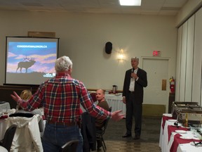 Larry Simpson answers questions from the crowd after his talk at the Rotary luncheon in Pincher Creek. Greg Cowan photo/QMI Agency.