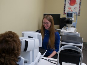 Dr. Laura Kennedy uses a machine to test a patient's field of vision in Pincher Creek. Greg Cowan photo/QMI Agency.