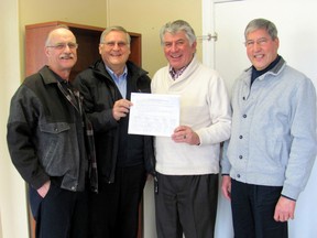 Representatives of the Social Justice Group of St. Mary’s Parish, Tillsonburg met with MP Dave MacKenzie Monday, March 10 at 11 a.m. at his constituency office in town to present a 100-plus-name petition calling for the creation of an independent extractive-sector Ombudsman in Canada. From left to right, are: Richard Laplante, Ed De Decker, Dave MacKenzie and Deacon Andre De Decker.
