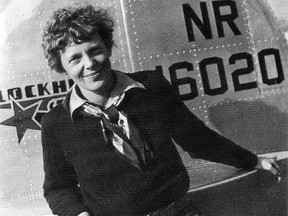 Famed aviatrix Amelia Earhart is pictured with her Lockheed Electra10E before her ill fated quest to fly around the world in this undated photograph.  REUTERS/PRNewsFoto/Newscom/Handout