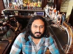 Barley Brothers beer manager Raj Maniar behind the bar at the Empress Street craft beer pub and eatery on Thu., March 13, 2014. The city's first craft beer pub is rolling out its first tap takeover, with California's Anderson Valley Brewing pouring out of 10 of its 72 taps on Monday. (Kevin King/Winnipeg Sun)