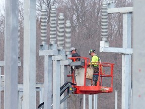 A crew works to install disconnect switches at a substation in the Bornish Wind Energy Centre. (Free Press file photo)