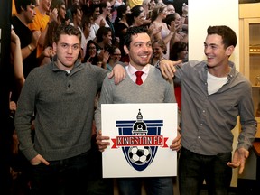 Kingston FC players, from left, Ryan McCurdy, Guillaume Surot and Joe Zupo share a laught a media conference at  Queen's University's Athletics and Recreation Centre on Thursday. (Ian MacAlpine/The Whig-Standard)